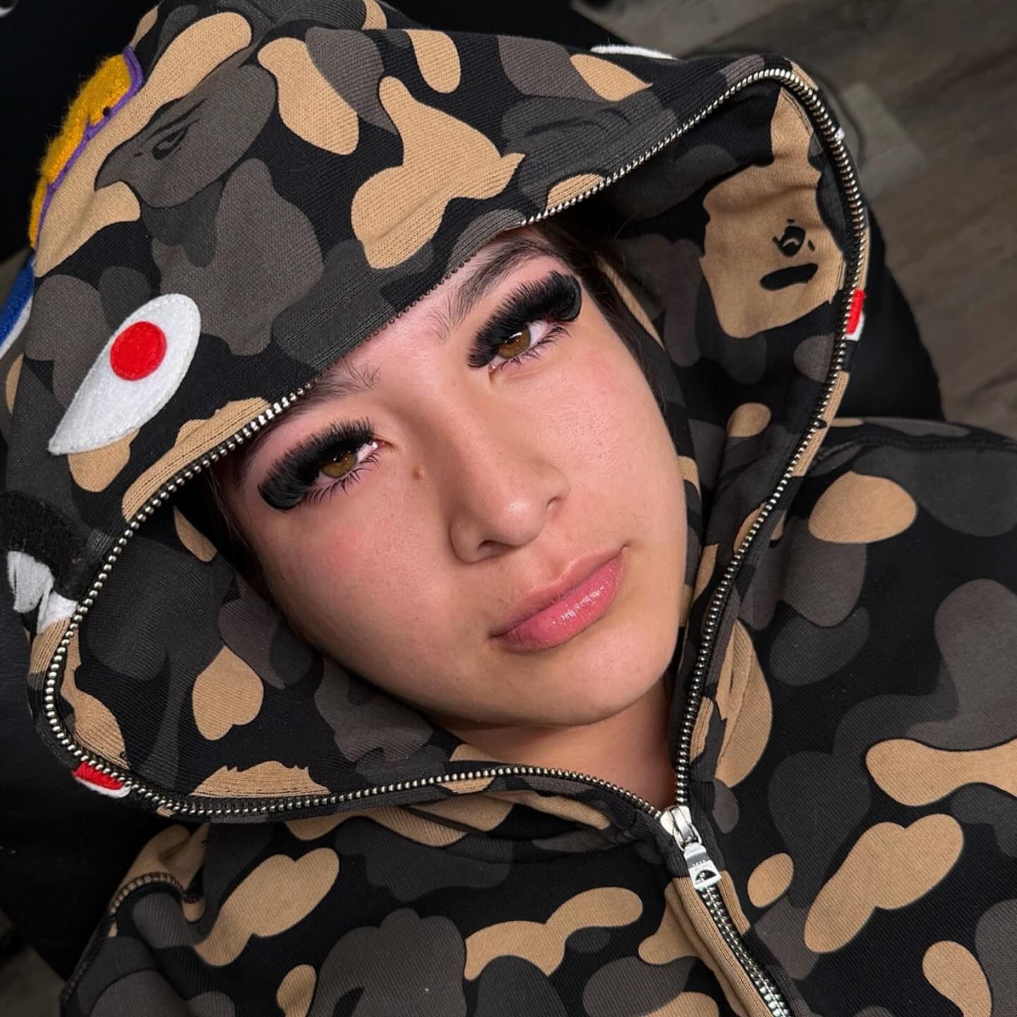 Mega volume set framed by a camo hood